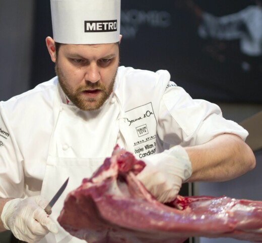 Norwegian chef Christopher William Davidsen trims game meat at the beginning of the Bocuse dOr European Cuisine contest in Budapest, Hungary, Tuesday, May 10, 2016. The contesters must prepare a sterlet dish and a red deer dish during the two-day culinary competition. (Balazs Mohai/MTI via AP)